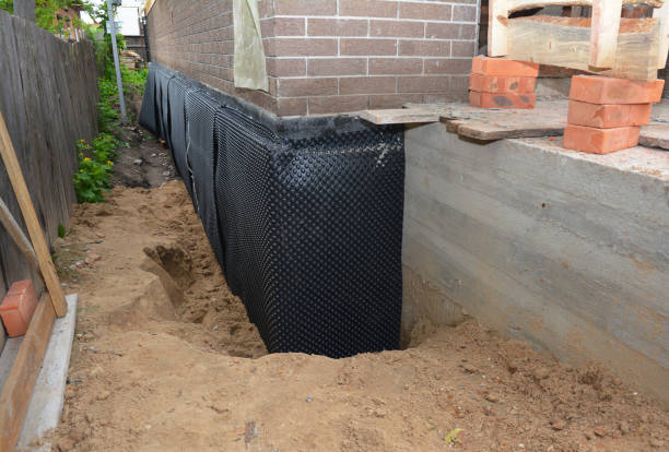 Happy homeowners after waterproofing job in Van Dyne